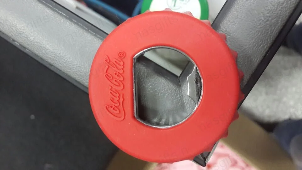 Coca-Cola silicone two-function bottle opener, front view — Czech Republic 2012