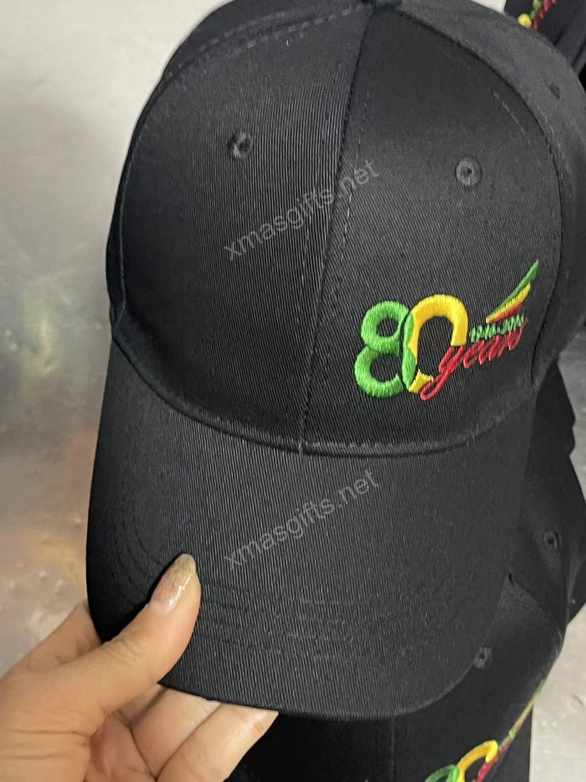 Black cap with detailed winged embroidery