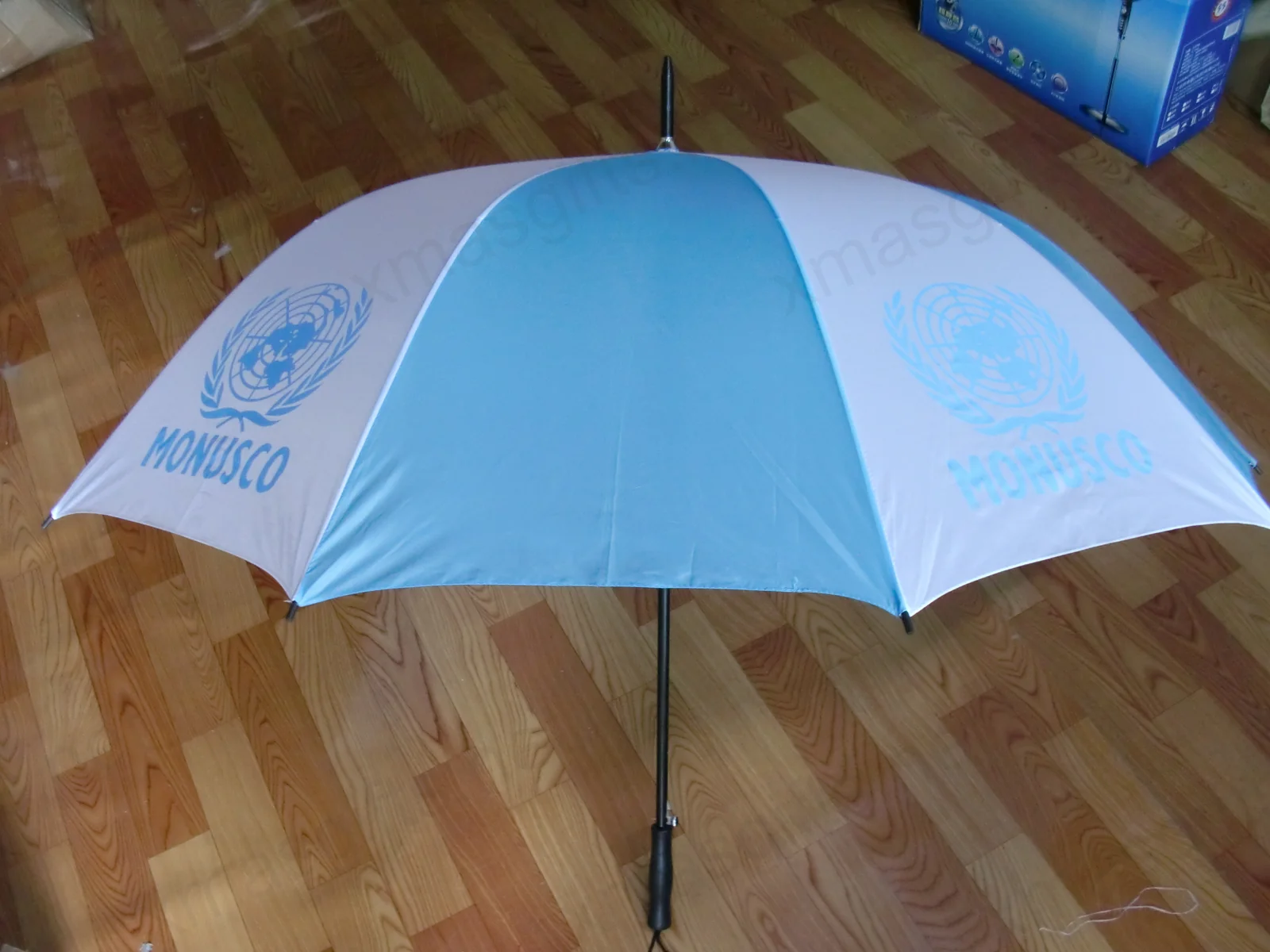 Blue and white MONUSCO folding umbrella