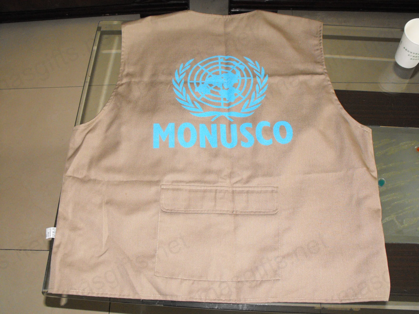 Khaki reporter vest back with UN emblem and MONUSCO text